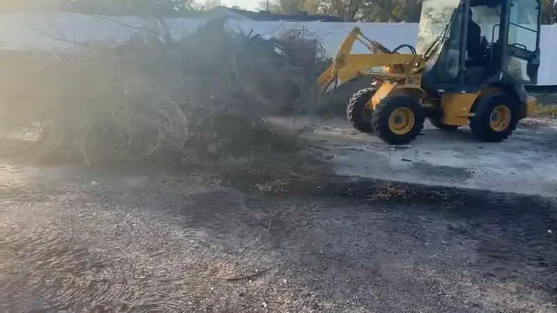 Debris pile being consolidated on a cleared site